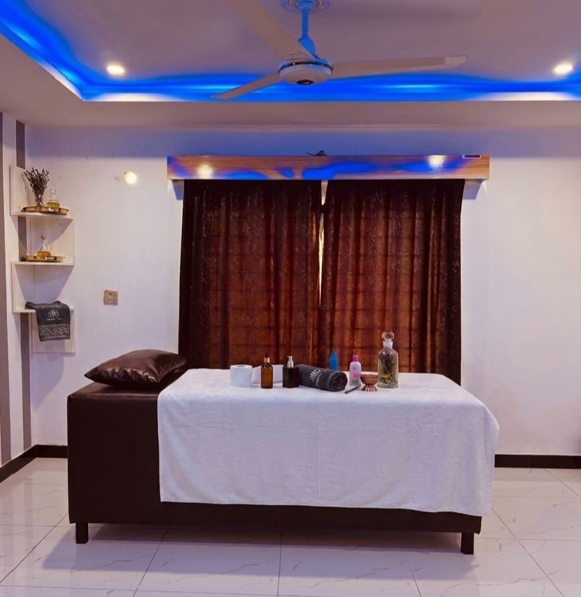 Treatment room with brown curtains and blue ceiling light